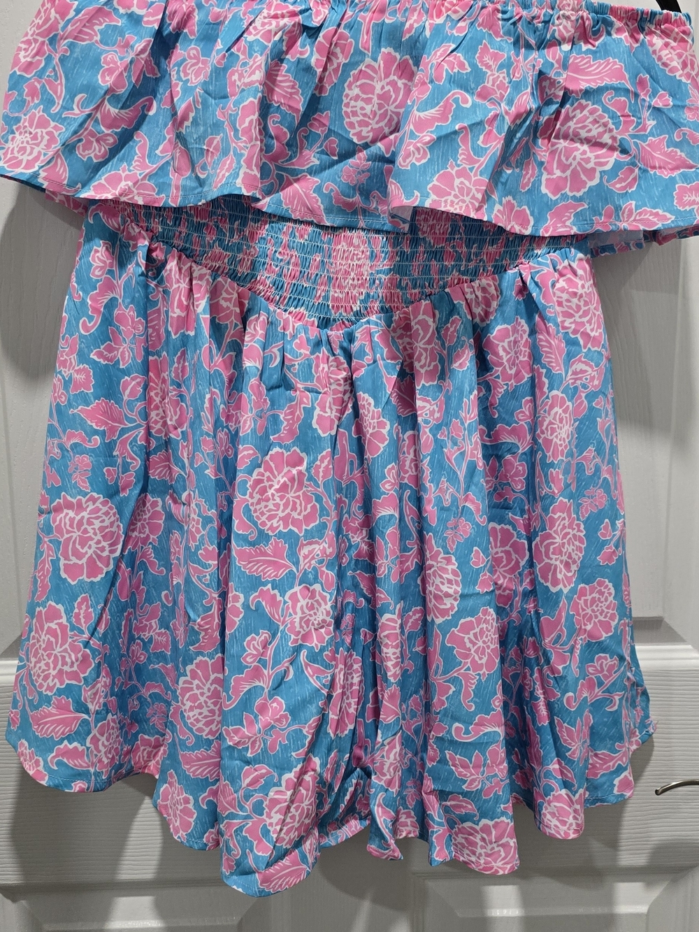 Off-Shoulder Pink Floral Romper on Blue